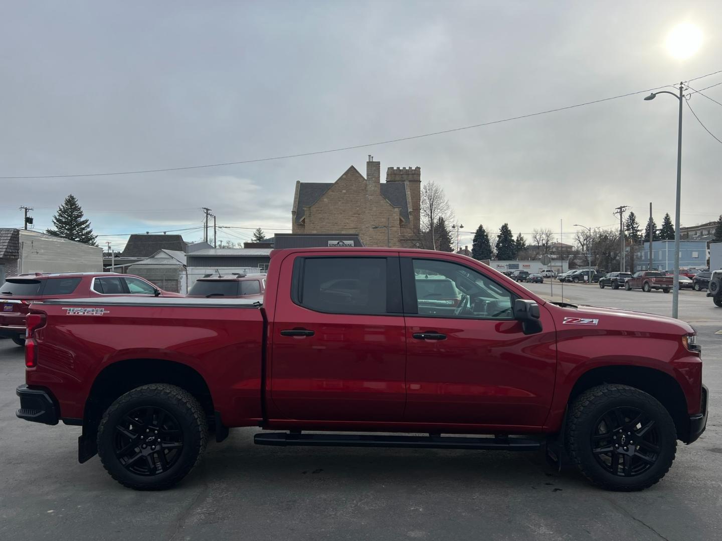 2021 Maroon /Charcoal Chevrolet Silverado 1500 Trail Boss (1GCPYFEL5MZ) with an 6.2L DI V8 engine, automatic transmission, located at 116 5th Avenue South, Lewistown, MT, 59457, 47.063877, -109.427879 - Explore the Rugged Elegance of Our Pre-Owned 2021 Chevrolet Silverado 1500 Crew Cab Trail Boss with a Mighty 6.2L Engine! Unleash the power of the open road with our exceptional 2021 Chevrolet Silverado 1500 Crew Cab Trail Boss. This pre-owned gem is equipped with a formidable 6.2L engine, delive - Photo#1